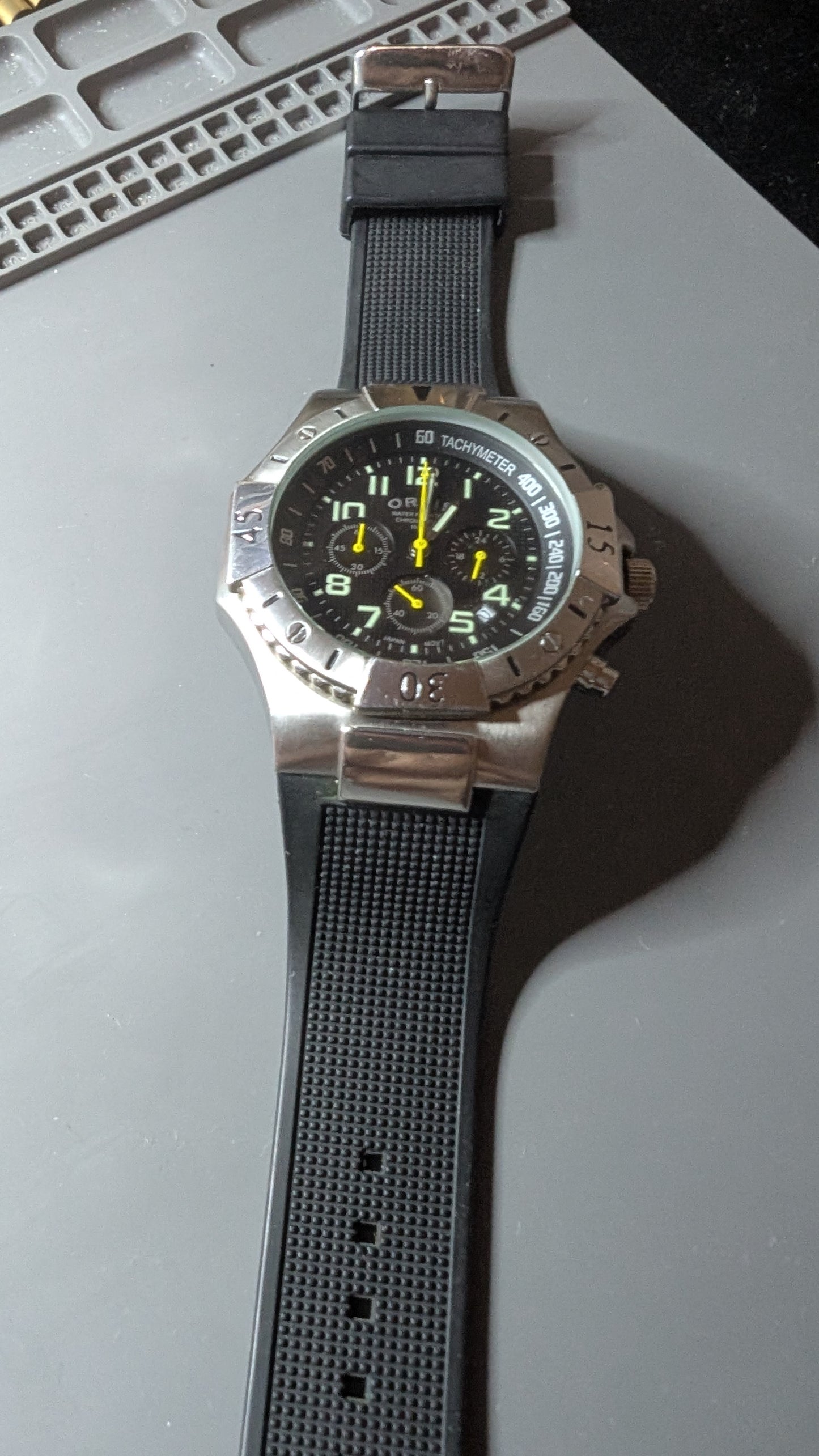 Orvis chronograph diver style watch with silicone diver style band and new battery. Very good condition. Keeps great time.
