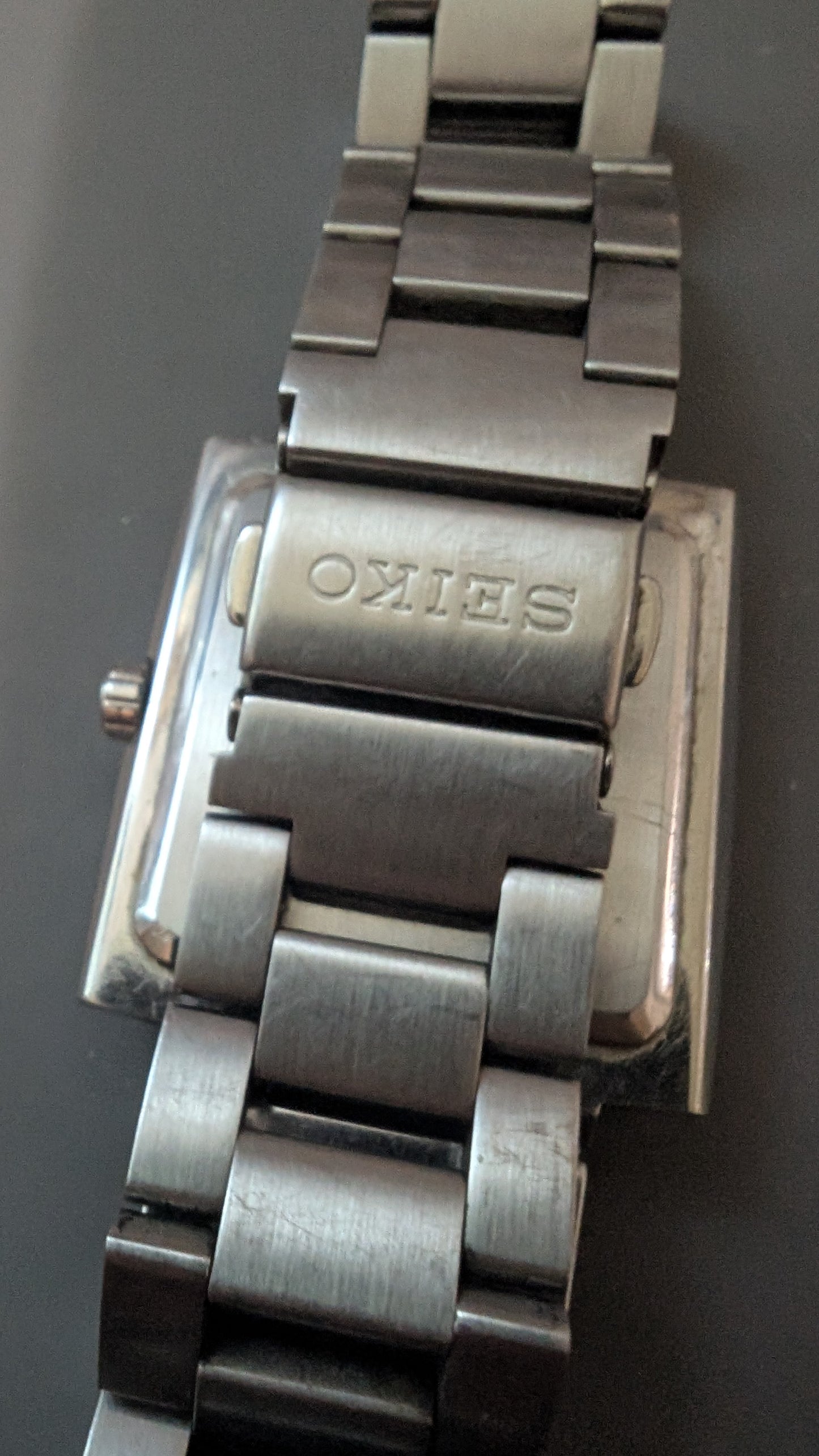 Seiko Spirit tank style quartz watch with new battery and original bracelet. Band. Keeps good time.
