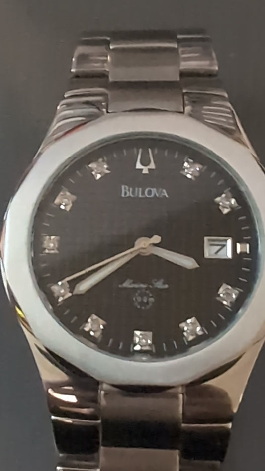 Mint Bulova Marine Star quartz watch with new battery and original bracelet band. Has 10 diamonds on dial. Keeps perfect time.