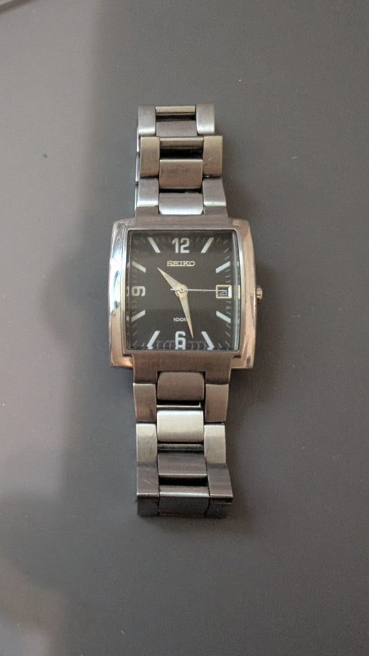 Seiko Spirit tank style quartz watch with new battery and original bracelet. Band. Keeps good time.